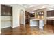 Modern kitchen with stainless steel appliances and granite countertops boasts an island with space to eat at 11228 Hedgemont Ave, Las Vegas, NV 89138
