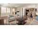 Comfortable living room features neutral tones and two armchairs, perfect for relaxation and conversation at 11228 Hedgemont Ave, Las Vegas, NV 89138