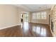 Spacious living room with stone fireplace, hardwood floors, and lots of natural light at 11228 Hedgemont Ave, Las Vegas, NV 89138