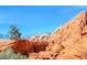A beautiful Red Rock Canyon mountain landscape featuring rock formations and desert vegetation under a clear sky at 11228 Hedgemont Ave, Las Vegas, NV 89138