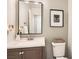 Modern half-bathroom features a vanity, toilet, and stylish decor at 11278 Tenza Ct, Las Vegas, NV 89141
