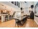 Open dining room with hardwood floors and high ceiling, adjacent to the kitchen area at 11278 Tenza Ct, Las Vegas, NV 89141