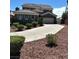 Charming two-story home features a well-manicured front yard, concrete driveway, and a two-car garage at 11278 Tenza Ct, Las Vegas, NV 89141