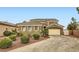 Charming stucco home with a tile roof and a two car garage on a sunny day at 11278 Tenza Ct, Las Vegas, NV 89141