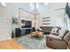 Well lit living room with a high ceiling, hardwood floors and a comfortable seating area at 11278 Tenza Ct, Las Vegas, NV 89141
