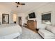 Spacious main bedroom with a TV and an ensuite bathroom at 11278 Tenza Ct, Las Vegas, NV 89141