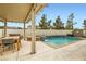 Backyard pool area, with a built-in hot tub, a table setting, and a relaxing outdoor experience at 11278 Tenza Ct, Las Vegas, NV 89141