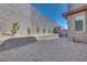 Low-maintenance backyard with gravel landscaping and a modern block wall at 11946 Glide Reflection Ave, Las Vegas, NV 89138