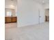 Spacious area leading to bathroom featuring wooden cabinets and carpet at 11946 Glide Reflection Ave, Las Vegas, NV 89138