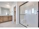 Bright bathroom featuring a glass-enclosed shower with a built-in bench at 11946 Glide Reflection Ave, Las Vegas, NV 89138