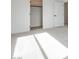 Sunlit bedroom with neutral carpet and a closet with traditional door at 11946 Glide Reflection Ave, Las Vegas, NV 89138