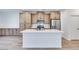 Kitchen featuring an island with white countertop and stainless steel appliances at 11946 Glide Reflection Ave, Las Vegas, NV 89138