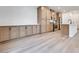 Well-lit kitchen featuring wooden cabinets, an island, and modern appliances at 11946 Glide Reflection Ave, Las Vegas, NV 89138