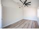 Bright bedroom features sleek wood floors and a modern ceiling fan at 1620 Western Lily St, Las Vegas, NV 89128