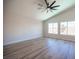 Spacious bedroom featuring high ceilings and wood-look floors at 1620 Western Lily St, Las Vegas, NV 89128