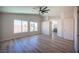 Expansive bedroom with recessed ceilings, wood-look floors, and an adjacent bathroom at 1620 Western Lily St, Las Vegas, NV 89128