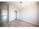 Bedroom with wood-look flooring and closet with sliding doors at 1620 Western Lily St, Las Vegas, NV 89128