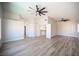 Large bedroom with wood-look flooring and doorways leading to other rooms at 1620 Western Lily St, Las Vegas, NV 89128