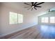 Open bedroom with natural light, wood flooring, and a ceiling fan at 1620 Western Lily St, Las Vegas, NV 89128
