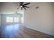 Spacious bedroom featuring wood floors, a ceiling fan, and lots of natural light at 1620 Western Lily St, Las Vegas, NV 89128