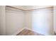 Walk-in closet featuring built-in shelving and wood-look floors at 1620 Western Lily St, Las Vegas, NV 89128