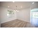 Inviting dining room with modern lighting and views of the pool at 1620 Western Lily St, Las Vegas, NV 89128