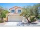 Charming two-story home featuring a well-maintained lawn and a two-car garage at 1620 Western Lily St, Las Vegas, NV 89128