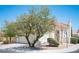 Charming two-story home featuring a well-maintained lawn, stucco, and large shade tree at 1620 Western Lily St, Las Vegas, NV 89128