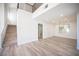 Bright foyer with staircase, modern railings, wood-look floors, and open layout at 1620 Western Lily St, Las Vegas, NV 89128