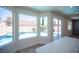 Large kitchen island with quartz countertop with direct view of the pool outside the bay windows at 1620 Western Lily St, Las Vegas, NV 89128