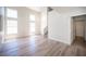 Spacious living room with soaring ceilings, lots of windows, and wood-look floors at 1620 Western Lily St, Las Vegas, NV 89128