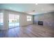 Open concept living area with backyard pool access and modern fireplace at 1620 Western Lily St, Las Vegas, NV 89128