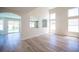 Bright open-concept living room showcasing modern archways and wood-look floors at 1620 Western Lily St, Las Vegas, NV 89128