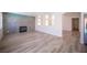 Spacious living area with modern fireplace featuring seamless open floor plan at 1620 Western Lily St, Las Vegas, NV 89128