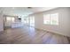 Open concept living area features modern kitchen and access to backyard pool at 1620 Western Lily St, Las Vegas, NV 89128