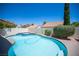 Sparkling backyard pool and spa surrounded by lush landscaping and privacy walls at 1620 Western Lily St, Las Vegas, NV 89128