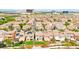 Wide aerial shot showcasing community's houses and surrounding area at 1887 Hollywell St, Las Vegas, NV 89135