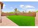The artificial grass gives a luxurious look and feel to this cozy backyard at 1887 Hollywell St, Las Vegas, NV 89135