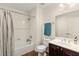 Bathroom with a shower-tub combination, vanity with sink, and tile floors at 1887 Hollywell St, Las Vegas, NV 89135