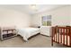 This bedroom features a cozy single bed, crib, and plenty of natural light from the window at 1887 Hollywell St, Las Vegas, NV 89135