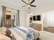 Bright, airy bedroom with a balcony access, seamless access to the kitchen, and stylish furnishings, offering a relaxing escape at 1887 Hollywell St, Las Vegas, NV 89135