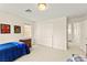 Bright bedroom with a closet, dresser, and comfortable single bed with a view into the landing at 1887 Hollywell St, Las Vegas, NV 89135