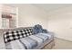 Comfortable bedroom with a daybed, pillows, closet, and bright natural light from a nearby window at 1887 Hollywell St, Las Vegas, NV 89135