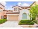 Charming two-story home with a two car garage, manicured landscaping, and a traditional architectural design at 1887 Hollywell St, Las Vegas, NV 89135