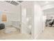Hallway with white walls, leading to a bedroom with a desk, chair, and large window at 1887 Hollywell St, Las Vegas, NV 89135
