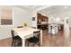 Kitchen and dining area seamlessly blend, featuring modern appliances, and a cozy dining space with backyard view at 1887 Hollywell St, Las Vegas, NV 89135