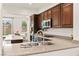 Well-equipped kitchen featuring stainless steel appliances, granite countertops, a large island, and modern cabinets at 1887 Hollywell St, Las Vegas, NV 89135