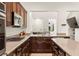 Stylish kitchen boasts granite countertops, stainless steel appliances, and seamless connection to the living area at 1887 Hollywell St, Las Vegas, NV 89135