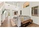 Bright living room featuring high ceilings, an oversized sofa, tile floors and lots of natural light at 1887 Hollywell St, Las Vegas, NV 89135