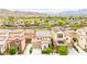 Charming street view showcasing multiple homes with well-maintained landscaping and mountain backdrop at 1887 Hollywell St, Las Vegas, NV 89135